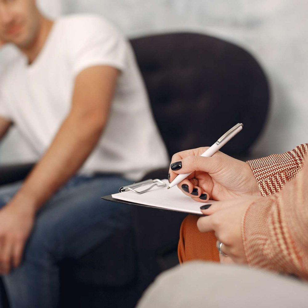 man-sitting-psychologist-s-office-talking-about-problems-1